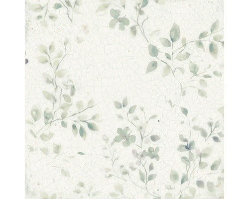 Dekorative Fliese mit filigranem Blattmuster und Blumen auf hellem Grund mit Craquelé-Effekt.