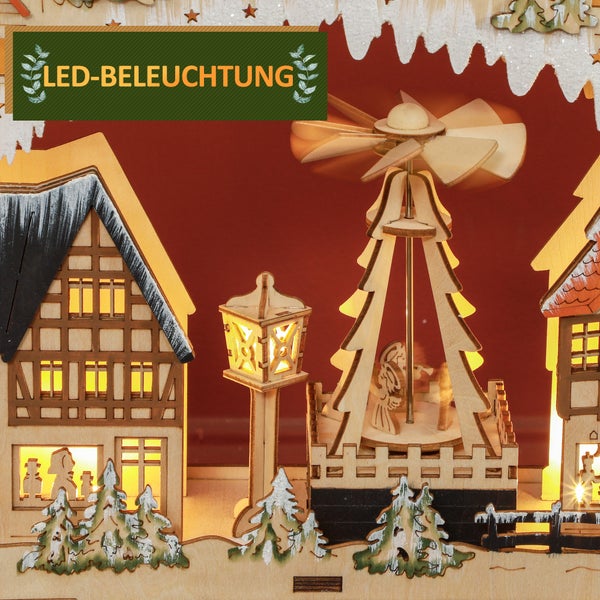 Weihnachtsdekoration aus Holz mit Häusern, Straßenlaterne und Weihnachtspyramide, beleuchtet mit warmweißen LEDs.