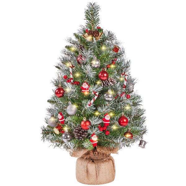 Geschmückter kleiner Weihnachtsbaum in Jute eingewickelt