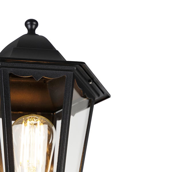 Schwarze Außenwandleuchte im Laternen-Stil aus Metall und Glas mit leuchtendem LED-Filament-Leuchtmittel.
