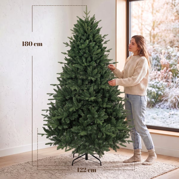 Künstlicher Weihnachtsbaum in Vorher Nachher Darstellung mit Empfehlung zur Aufbauzeit von 30 bis 50 Minuten für das Ausrichten der Zweige.