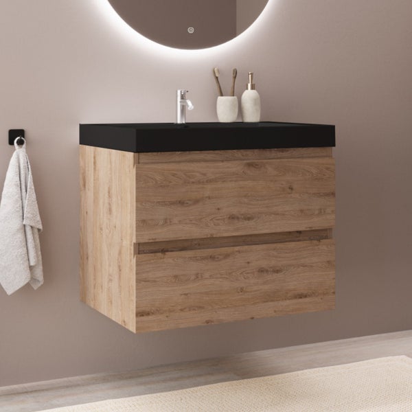 Wandhängender Waschtischunterschrank in Holzoptik mit zwei Schubladen und schwarzem Waschtisch in einem modernen Badezimmer.