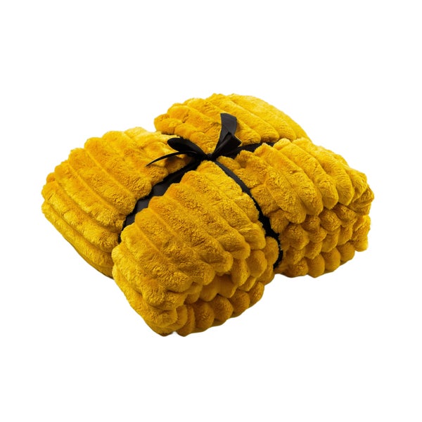 Zusammengelegte Kuscheldecke mit Band