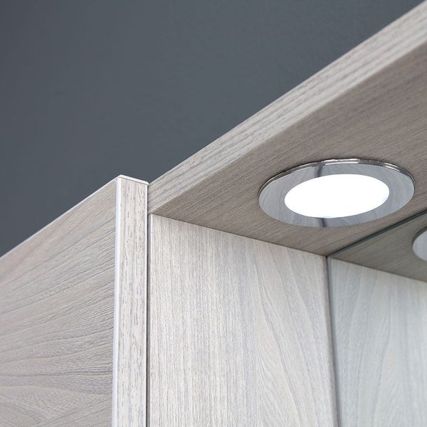 Spiegelschrank in heller Holzoptik mit integriertem rundem LED-Spot.