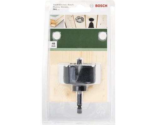 Dekoratives Schild mit der Aufschrift Hurra und Topfpflanze auf einem Tisch.