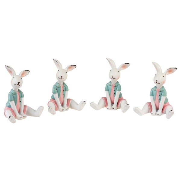 Vier sitzende Osterhasen als Dekoration