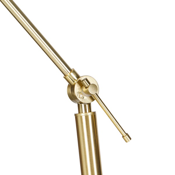 Nahaufnahme eines verstellbaren Gelenks einer Lampe aus Messing.