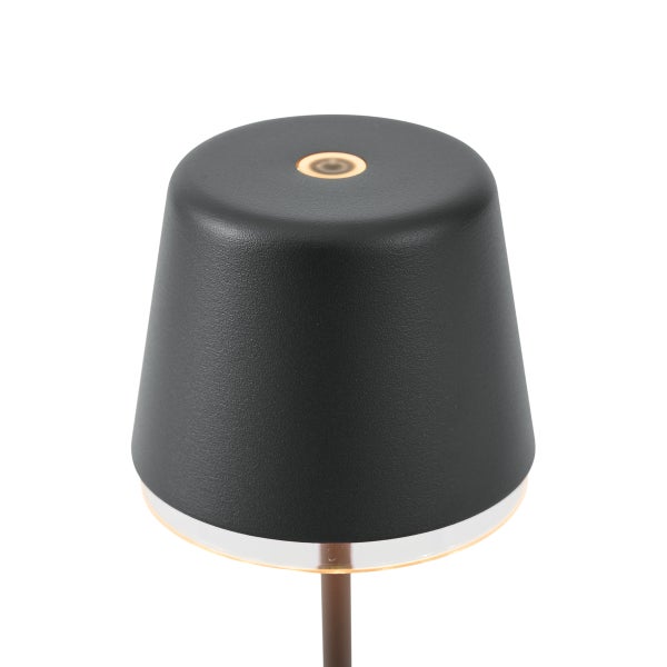 Moderner schwarzer Lampenkopf mit Berührungssensor oben und Lichtring an der Unterseite.