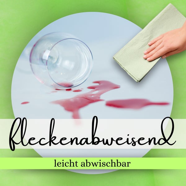 Rotweinflecken werden mit einem Tuch auf einem fleckenabweisenden, leicht abwischbaren Tisch entfernt