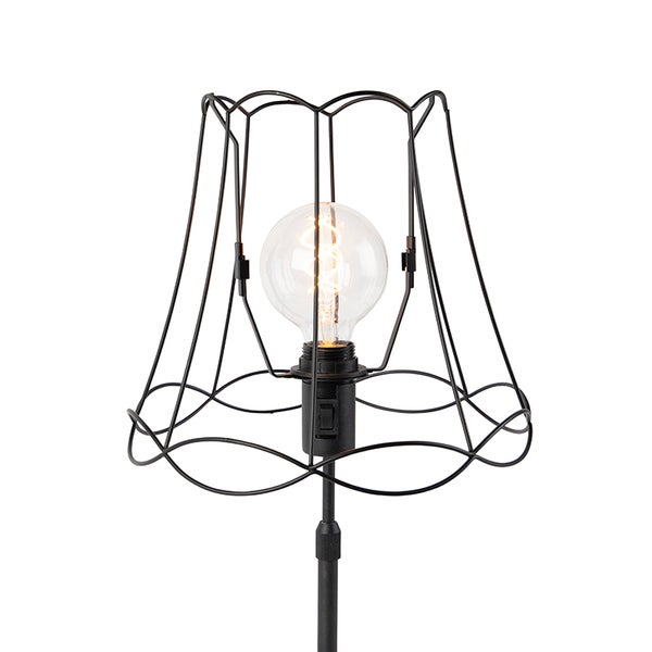 Stehlampe mit schwarzem Drahtschirm und Glühbirne