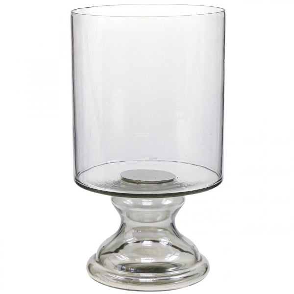 Zylindrisches Windlicht aus Glas auf einem Standfuß.