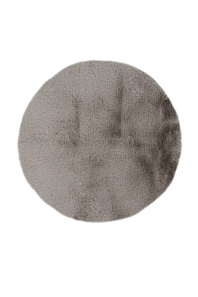 Runder Teppich aus grauem Kunstfell mit weicher Oberfläche.