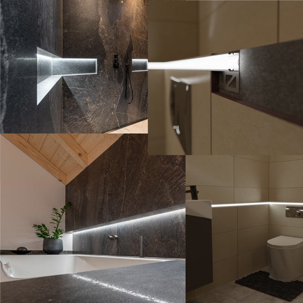 Moderne LED Lichtprofile integriert in Fliesenwände im Badezimmer für indirekte Beleuchtung und elegante Akzente.