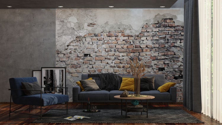 Wohnzimmer mit Sofa, Sessel und Ziegelwandtapete
