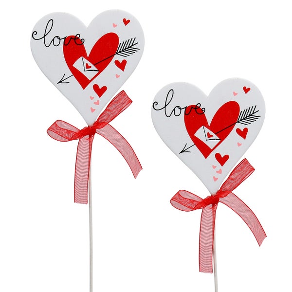 Zwei Herzstecker mit Liebesmotiv und Schleife