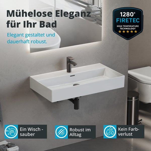 Modernes Bad mit rechteckigem Wandwaschbecken aus weißer Keramik, dunkler Armatur und Firetec Hochtemperaturtechnologie bei 1280 Grad.