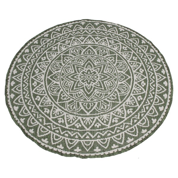 Runder Teppich mit gewebtem Mandala-Muster in Grün und Weiß.