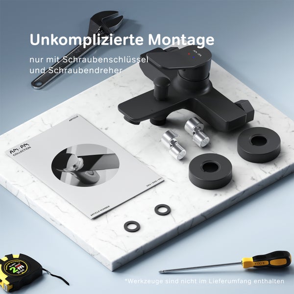 Schwarze Waschtischarmatur mit Montagezubehör, Schraubenschlüssel, Schraubendreher und Bedienungsanleitung auf einem Tisch.