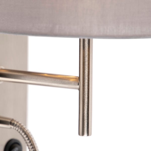 Detailaufnahme einer Wandleuchte mit Schirm und flexiblem Arm