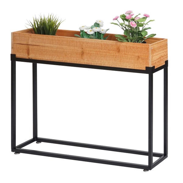 Hochbeet aus Holz mit schwarzem Metallgestell, bepflanzt mit Gras und Blumen.