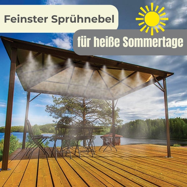 Pavillon auf Holzterrasse mit Sprühnebelsystem, das feinen Nebel über einer Sitzgruppe an einem See erzeugt.