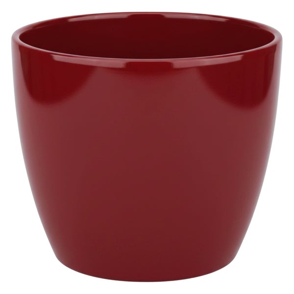 Roter glänzender Übertopf aus Keramik für Zimmerpflanzen.