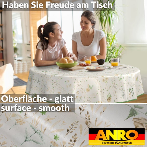 Tischgedeck mit blumengemusterter Tischdecke und Anro Logo.