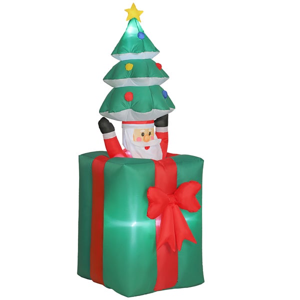 Aufblasbarer Weihnachtsmann in grüner Geschenkbox mit roter Schleife und Tannenbaum, beleuchtet.