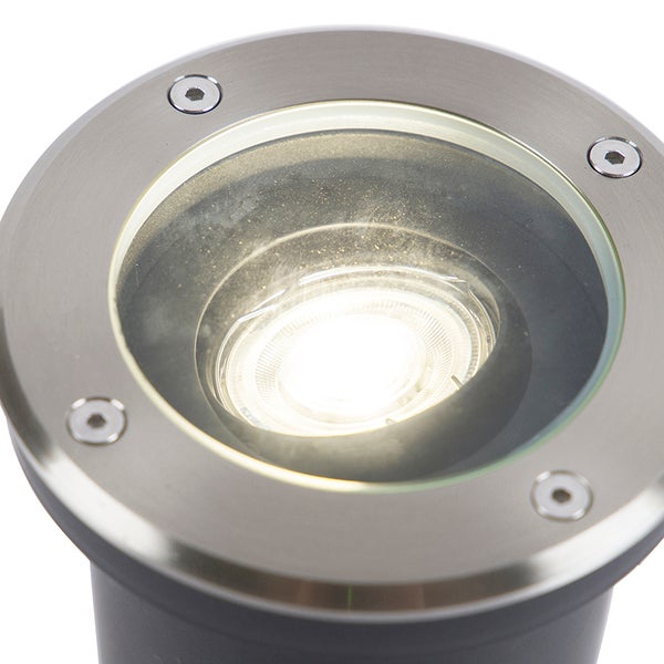 Runder LED-Bodeneinbaustrahler aus Edelstahl mit Glasscheibe und eingeschaltetem Leuchtmittel.