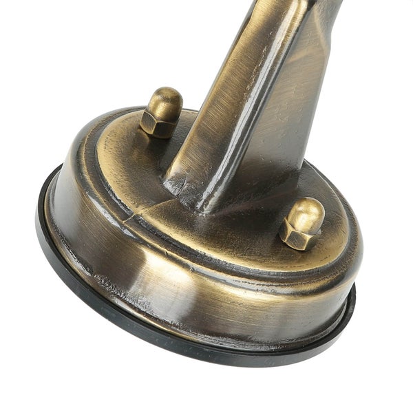 Detailansicht einer bronzefarbenen Lampenhalterung