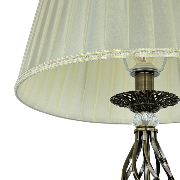 Tischleuchte mit Lampenschirm und dekorativem Fuß