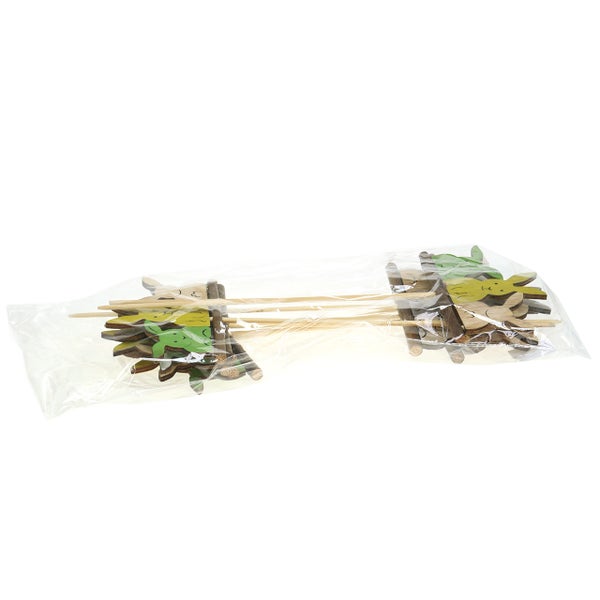 Dekorative Holzfiguren mit Stab in Plastikverpackung