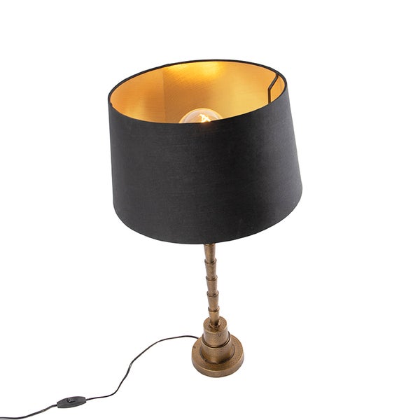 Tischleuchte mit Lampenschirm und verziertem Lampenfuß