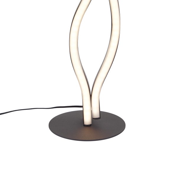 Runder Standfuß einer modernen LED-Lampe mit zwei geschwungenen, leuchtenden Lichtelementen.