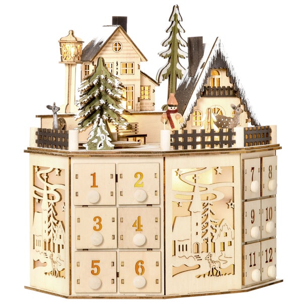 Adventskalender aus Holz mit Schubladen und einer beleuchteten Winterszene mit Häusern, Tannen und Rehen.