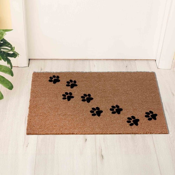 Fußmatte aus Kokosfaser mit Pfotenabdruckmuster vor einer Tür