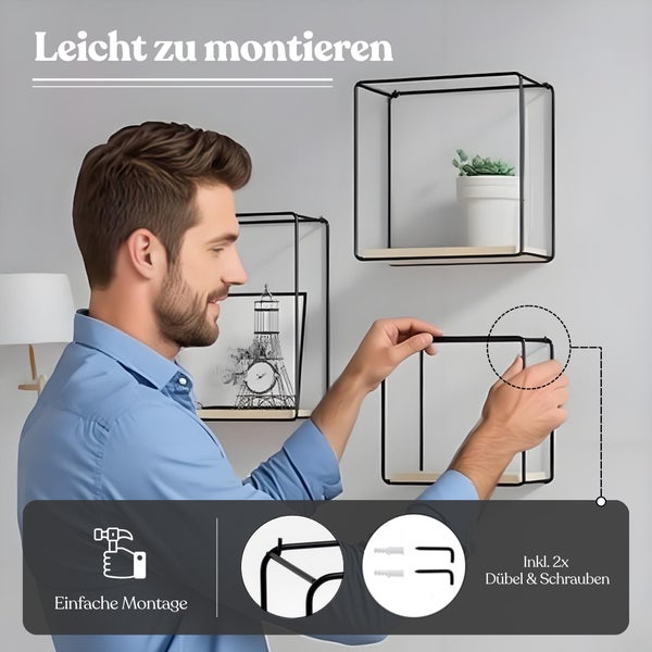 Mann montiert ein quadratisches Wandregal mit Metallrahmen und Holzboden. Einfache Montage inklusive zwei Dübeln und Schrauben.