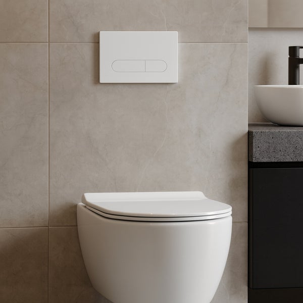 Detailaufnahme eines Badezimmers mit hängendem WC und Betätigungsplatte.