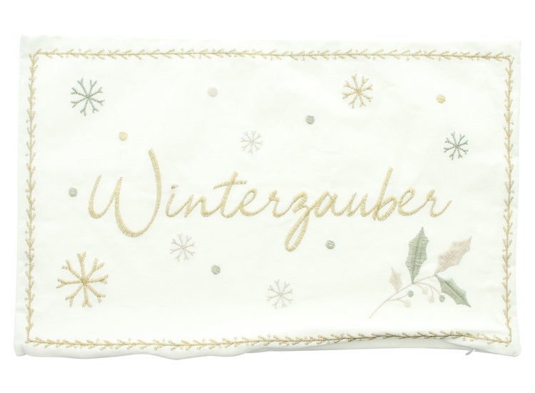 Dekokissen mit der Aufschrift Winterzauber, Schneeflocken und einem Blätterzweig
