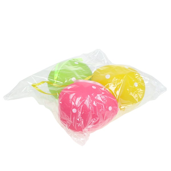 Verpackung mit drei Ostereiern mit Tupfen und Bändern