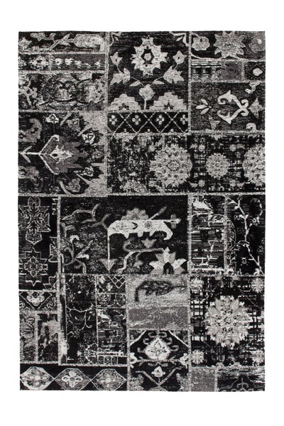 Teppich mit Patchwork-Muster und orientalischen sowie floralen Ornamenten, rechteckig, in Graustufen.