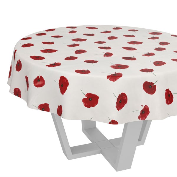 Runde Tischdecke mit Mohnblumen-Muster auf einem Tisch.