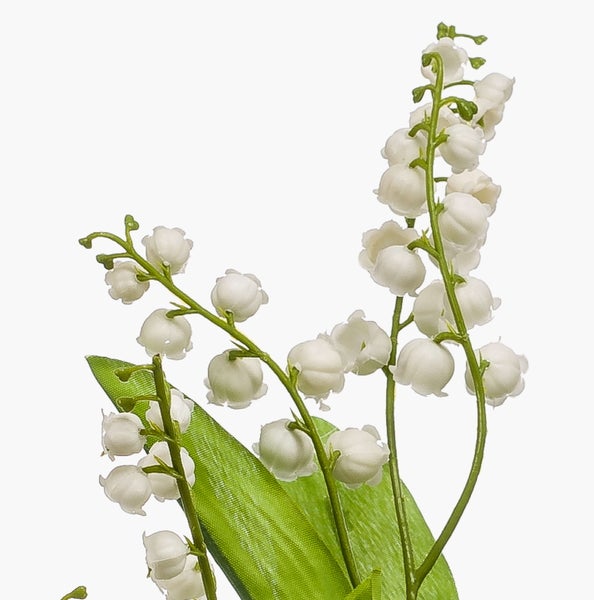 Künstliches Maiglöckchen mit weißen glockenförmigen Blüten und grünem Blatt.