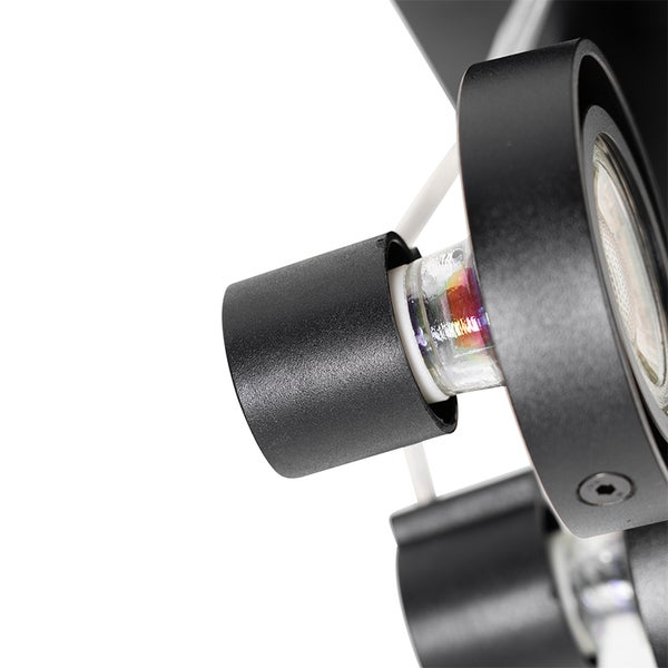 Nahaufnahme einer schwarzen Lampe mit Halogenleuchtmittel