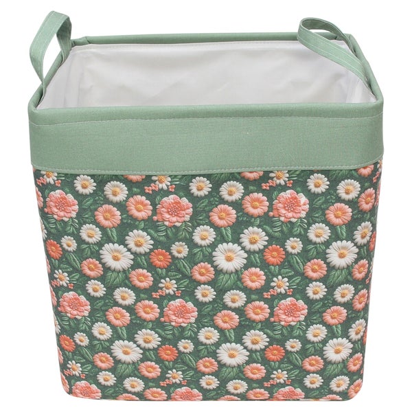 Eckiger Aufbewahrungskorb aus Stoff mit Blumenmuster, zwei Tragegriffen und weißer Innenseite.