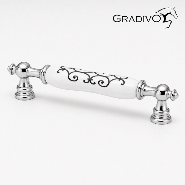 Nostalgischer Möbelgriff aus glänzendem Chrom und weißer Keramik mit schwarzem Ornamentmuster. Gradivo Logo.