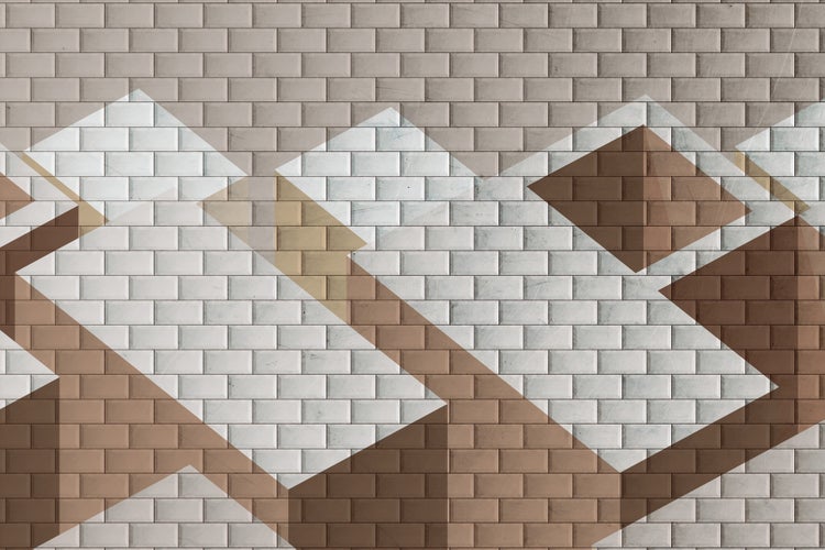 Wandfliesen mit einem geometrischen Muster aus überlappenden Rautenformen in Klinkeroptik.