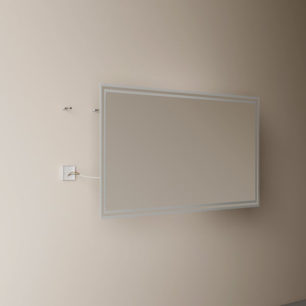 Rechteckige Infrarotheizung mit umlaufendem LED-Lichtrahmen bei der Wandmontage mit sichtbarem Elektroanschluss.
