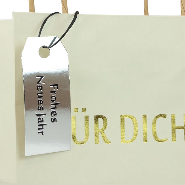 Geschenktüte mit der Aufschrift Frohes Neues Jahr