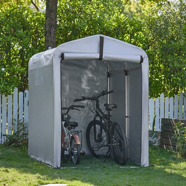 Fahrradzelt im Garten mit zwei Fahrrädern darin.